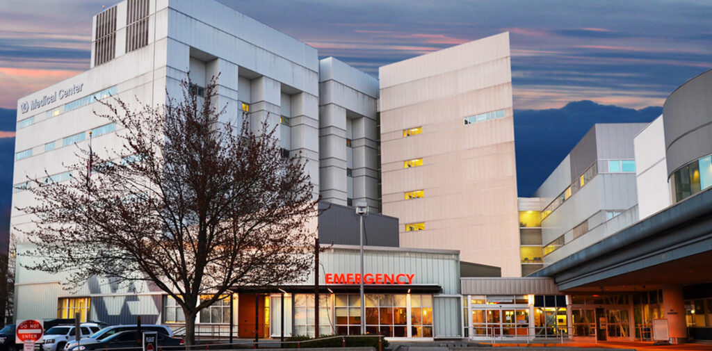 VAMC emergency center exterior image entrance at dusk