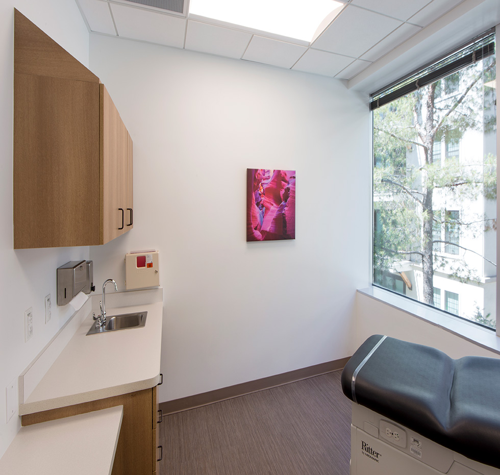 Interior exam room in healthcare setting with a window
