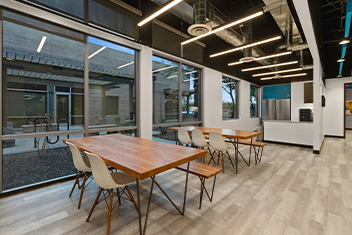 Cafe area with exposed HVAC celiling